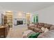 Cozy living room features a brick fireplace with built-in shelving and a comfortable couch at 3479 Sugar Loaf Ct, Carmel, IN 46033