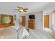 Serene main bedroom features neutral tones, ceiling fan, and ample closet space at 3479 Sugar Loaf Ct, Carmel, IN 46033