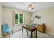 Bright office with a work desk, chairs, natural light and a view to the yard at 3479 Sugar Loaf Ct, Carmel, IN 46033