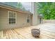 Backyard deck featuring wood construction and a cozy fire pit at 3898 Chelsea Ter, Greenwood, IN 46143