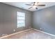 Bedroom with ceiling fan and large window providing natural light at 3898 Chelsea Ter, Greenwood, IN 46143
