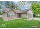 Inviting one-story home with brick and siding, a well-maintained lawn, and an attached garage at 3898 Chelsea Ter, Greenwood, IN 46143