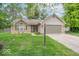 Charming one-story home with a brick facade, attached garage, and a well-manicured lawn at 3898 Chelsea Ter, Greenwood, IN 46143