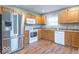 Well-lit kitchen featuring stainless steel refrigerator and white appliances at 3898 Chelsea Ter, Greenwood, IN 46143