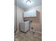 Laundry room features a modern washing machine and storage cabinets at 3898 Chelsea Ter, Greenwood, IN 46143