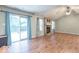 Spacious living area with hardwood floors, a fireplace, and sliding glass doors to outdoor deck at 3898 Chelsea Ter, Greenwood, IN 46143