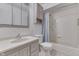 Well-lit bathroom showcasing a combined shower and tub, along with updated fixtures at 454 E Broadway St, Greenwood, IN 46143