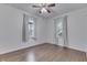 Bright bedroom with hardwood floors, neutral walls, and windows offering great light at 454 E Broadway St, Greenwood, IN 46143