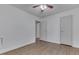 Bedroom featuring hardwood floors, neutral walls, modern fixtures, and ensuite entrance at 454 E Broadway St, Greenwood, IN 46143