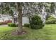 Charming house with a lush green lawn and mature trees in the yard at 454 E Broadway St, Greenwood, IN 46143