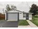 Detached single car garage with extra space for storage and a side door at 454 E Broadway St, Greenwood, IN 46143