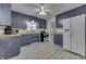 Traditional kitchen with blue cabinets, stainless steel appliances, and light countertops at 454 E Broadway St, Greenwood, IN 46143