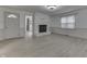 Bright living room featuring a white-painted brick fireplace and light wood-look flooring at 454 E Broadway St, Greenwood, IN 46143