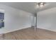 Bright, spacious living room featuring hardwood floors and a modern light fixture at 454 E Broadway St, Greenwood, IN 46143