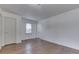 Spacious living area featuring hardwood floors and white walls at 454 E Broadway St, Greenwood, IN 46143