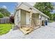 Charming back porch on a home featuring wood railings and steps at 4910 W Caven St, Indianapolis, IN 46241