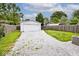 Detached garage, with gravel driveway and fenced yard at 4910 W Caven St, Indianapolis, IN 46241