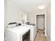 A laundry room with a full-size washer and dryer at 4910 W Caven St, Indianapolis, IN 46241