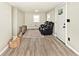 Spacious living room featuring hardwood floors and neutral wall colors at 4910 W Caven St, Indianapolis, IN 46241
