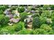 An aerial view of a neighborhood featuring lush greenery, mature trees, and well-maintained homes with a serene setting at 50 Charing Cross Rd, Indianapolis, IN 46217