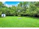 A spacious backyard featuring well-maintained lawn and a stone fire pit area perfect for gatherings at 50 Charing Cross Rd, Indianapolis, IN 46217