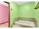 A bathtub with tile surround located inside a bathroom at 50 Charing Cross Rd, Indianapolis, IN 46217