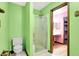 Bright bathroom with a toilet and shower at 50 Charing Cross Rd, Indianapolis, IN 46217