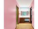 Bright bathroom vanity area featuring wood cabinets, mirrors, and hardwood floors at 50 Charing Cross Rd, Indianapolis, IN 46217