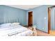 Charming bedroom with hardwood floors and a view of the closet and hallway at 50 Charing Cross Rd, Indianapolis, IN 46217