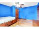 Bright bedroom featuring hardwood floors and a ceiling fan at 50 Charing Cross Rd, Indianapolis, IN 46217
