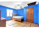 Cozy bedroom with hardwood floors, a ceiling fan, and a natural light-filled window at 50 Charing Cross Rd, Indianapolis, IN 46217