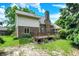 Exterior rear view of the home showcasing the brick facade and spacious wooden back deck at 50 Charing Cross Rd, Indianapolis, IN 46217