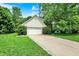 Garage exterior and a long driveway at 50 Charing Cross Rd, Indianapolis, IN 46217