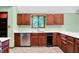Kitchen showcasing wood cabinets, white countertops, and stainless steel dishwasher at 50 Charing Cross Rd, Indianapolis, IN 46217