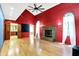 Bright living room featuring hardwood floors, fireplace, and large windows with sheer curtains at 50 Charing Cross Rd, Indianapolis, IN 46217