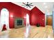 Spacious living room with a brick fireplace, hardwood floors, and an eye-catching ceiling fan at 50 Charing Cross Rd, Indianapolis, IN 46217