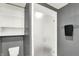 This bathroom features a frosted glass shower enclosure, white subway tile, and a sleek vanity at 514 Dorman St, Indianapolis, IN 46202