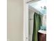 View of a bathroom vanity, mirror and white tiled shower/tub combo at 514 Dorman St, Indianapolis, IN 46202