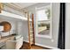 Cozy bedroom space with ladder to bed loft, desk, chair, and natural light at 514 Dorman St, Indianapolis, IN 46202