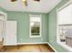 Bright bedroom with hardwood floors, neutral paint, and natural light from large windows at 514 Dorman St, Indianapolis, IN 46202
