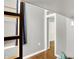 View of a bedroom loft and closet with a blue curtain from a hallway at 514 Dorman St, Indianapolis, IN 46202