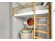 Close-up of a bedroom with a bed loft, desk, chair, and natural light at 514 Dorman St, Indianapolis, IN 46202
