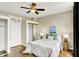 Comfortable bedroom features wood floors, a ceiling fan, natural light, and closet storage space at 514 Dorman St, Indianapolis, IN 46202