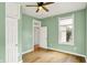 Light green bedroom with hardwood floors features lots of natural light and an airy, open feel at 514 Dorman St, Indianapolis, IN 46202