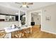 Inviting dining area with a white table, stylish seating, and an open view to the kitchen at 514 Dorman St, Indianapolis, IN 46202