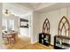 A dining room with hardwood floors and an adjacent kitchen and Gathering room at 514 Dorman St, Indianapolis, IN 46202
