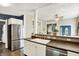 Bright kitchen with stainless steel appliances and stylish countertop, overlooking the dining room at 514 Dorman St, Indianapolis, IN 46202