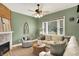 Inviting living room with a decorative fireplace, comfortable sectional, and large windows at 514 Dorman St, Indianapolis, IN 46202