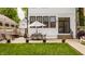 Beautiful backyard with outdoor dining, patio and lush green lawn at 5254 N Park Ave, Indianapolis, IN 46220