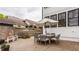 Back patio with outdoor dining table, wood fence and view of surrounding properties at 5254 N Park Ave, Indianapolis, IN 46220